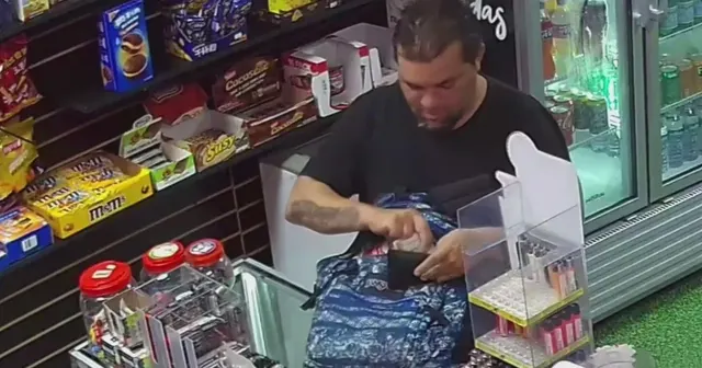 Man caught on camera stealing over $100 worth of Pokemon cards from Sweetwater shop — image from CBS News
